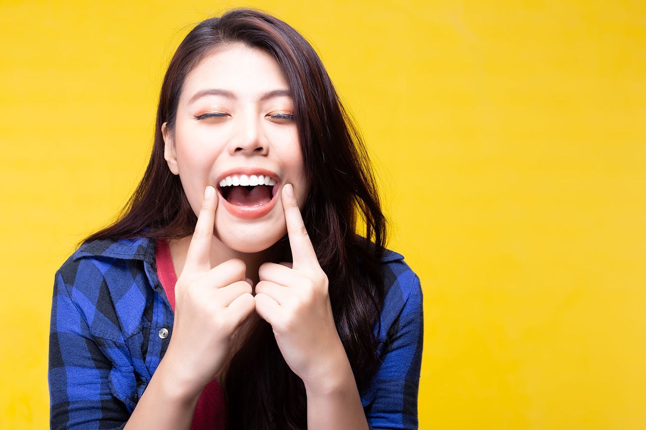 beautiful woman has tooth white teeth