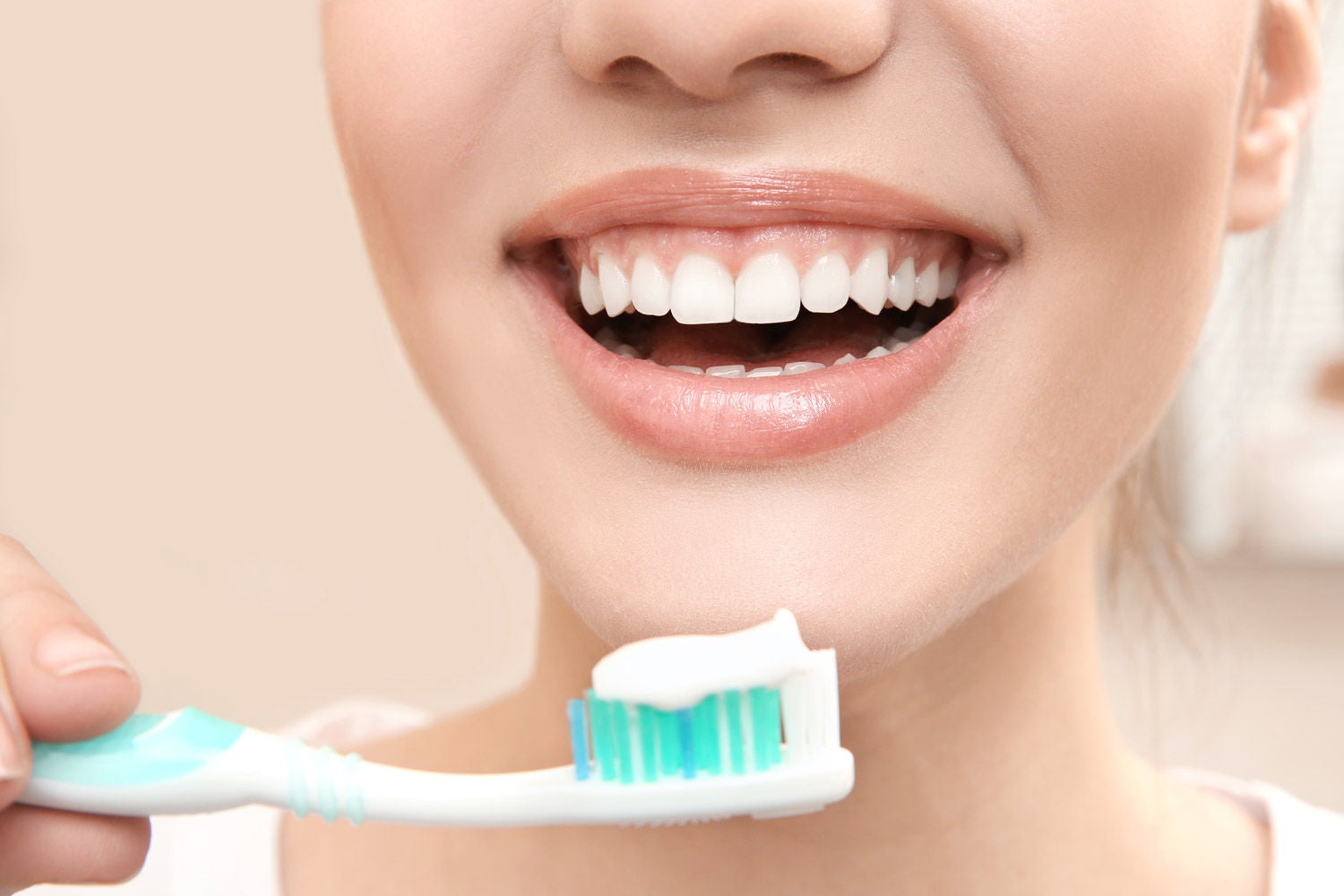 629136848 beautiful woman brushing teeth closeup