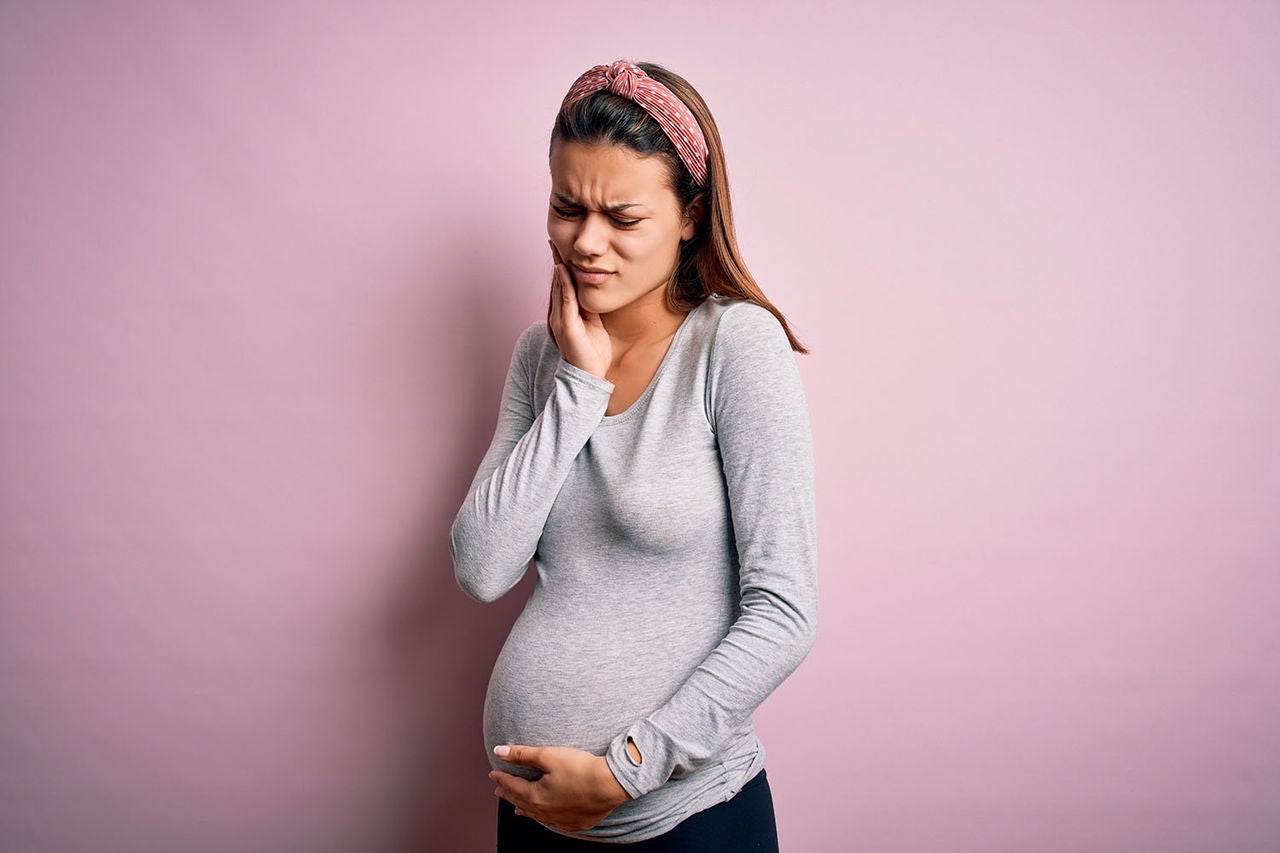 young beautiful teenager girl pregnant expecting