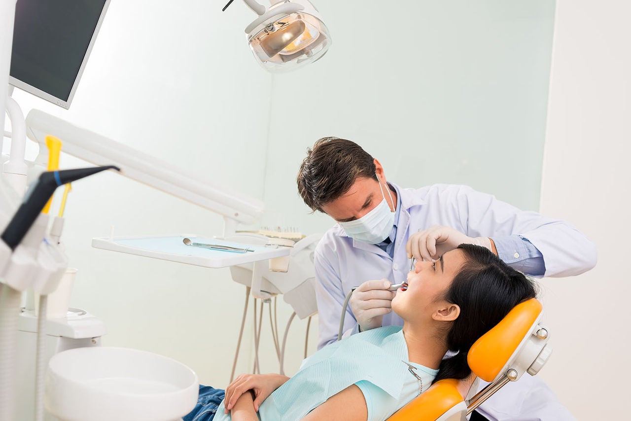 dentist treating female patient