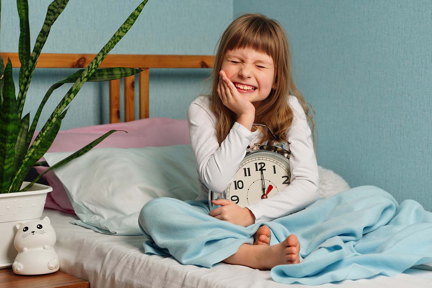 blonde child girl touching mouth hand
